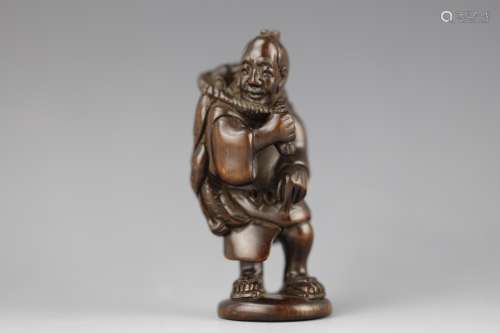 Vintage Netsuke carved rosewood fisherman.