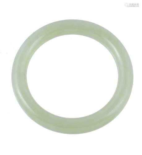 A Chinese celadon jadeite bangle, with white inclusions, external diameter 8cm and internal wrist