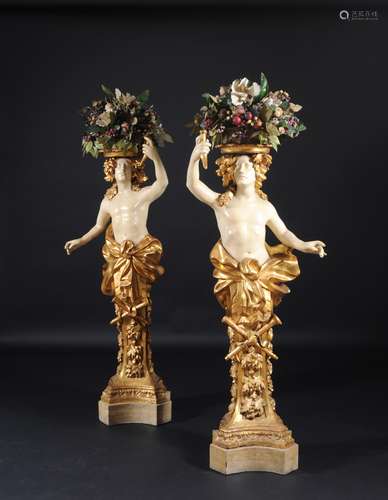 PAIR OF HERMS CARRYING FLOWERS