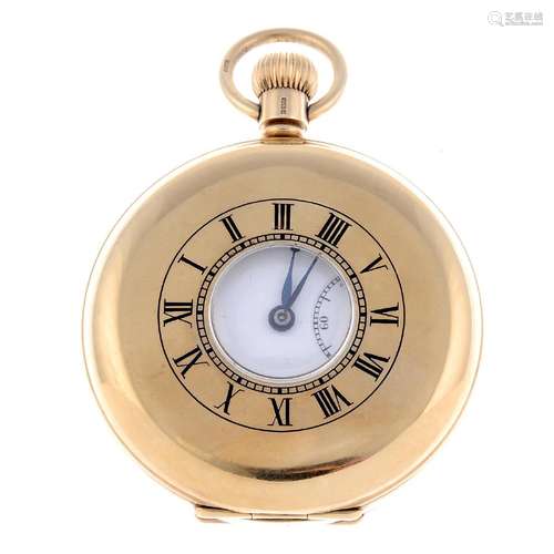 A half hunter pocket watch by J.W Benson. 9ct yellow