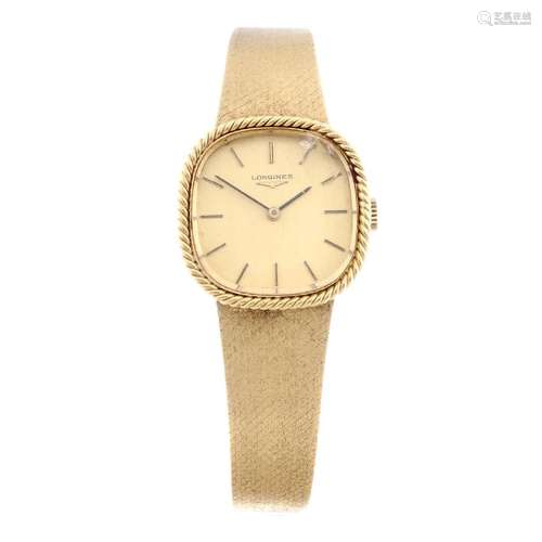 LONGINES - a lady's bracelet watch. Yellow metal case,