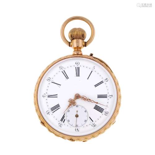 An open face pocket watch. Yellow metal case with