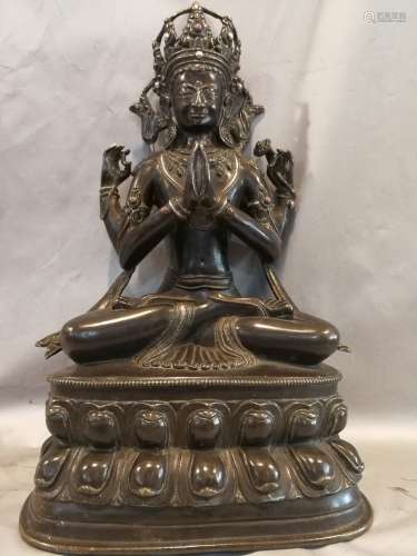 A BRONZE GLITED FOUR ARMS OF GUANYIN FIGURE