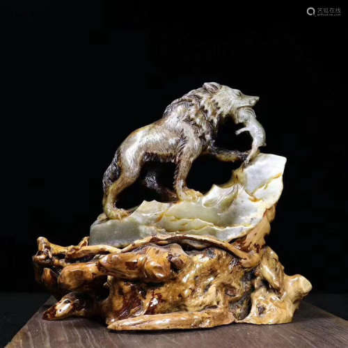 A OLD HETIAN JADE CARVED WOLF PENDANT