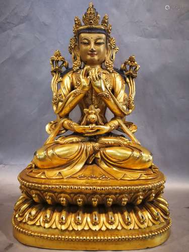 A BRONZE GLITED FOUR ARMS OF SHOU BUDDHA