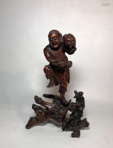 Carved Boxwood Figure of Man Holding Coin and Animal