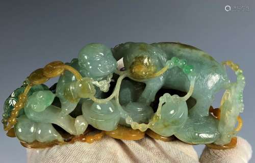 A Carved Natural Three Colore  Jadeite Figure Of...
