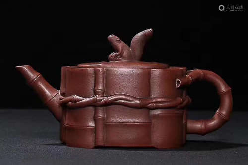 A QUANYINSHEJI MARK OLD RED CLAY 'A BUNDLE OF BAMBOO' DESIGN TEAPOT
