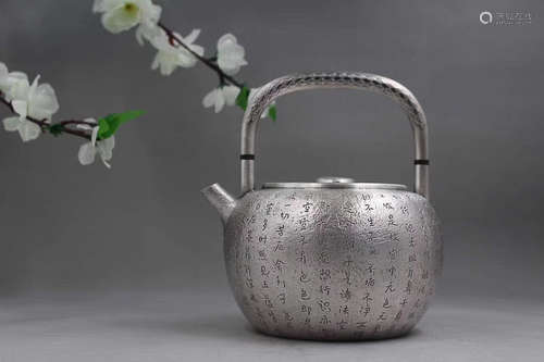 A SCRIPTURE DESIGN SILVER TEAPOT