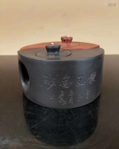 A EIGHT TRIGRAMS SHAPED ZISHA TEAPOT WITH A MARK