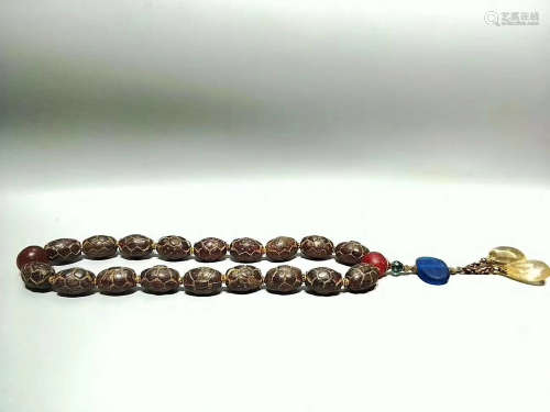 A RED AMBER BEADS PENDANT