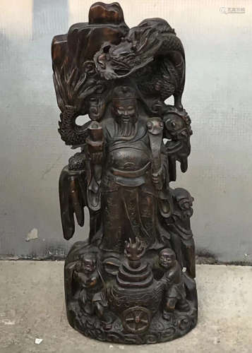 A HUANGYANG WOOD FIGURE OF CAISHEN