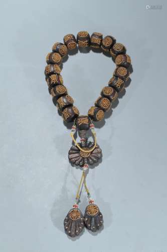 A gold-bead inlaid agarwood rosary bracelet