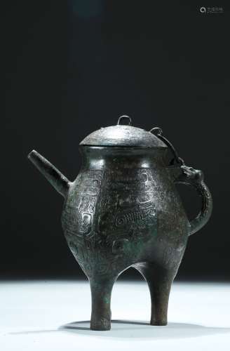 A bronze 'taotie' ritual wine vessel, He