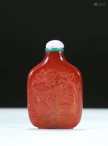 An amber carved 'lotus and ducks' snuff bottle