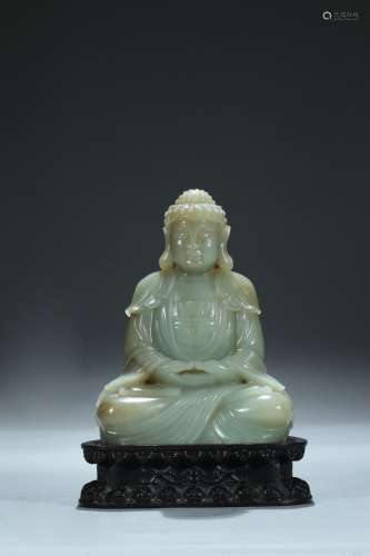 A celadon jade carving of Amitabha