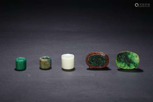 A group of five jadeite rings and buckles