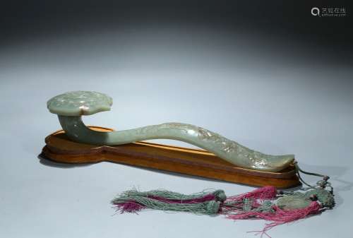 A large celadon jade 'bat and peach' ruyi scepter