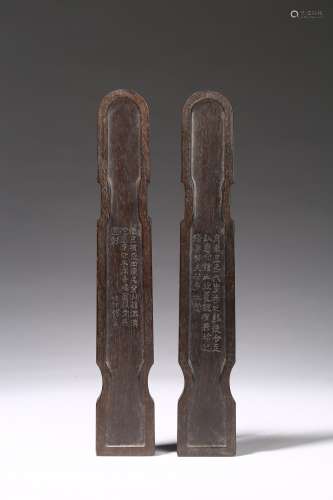 A pair of zitan qin-shape inscribed wristrests