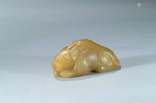 A yellow jade carving of mythical beast