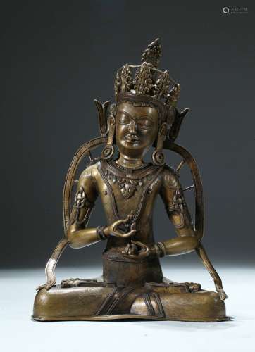 A copper and silver inlaid copper alloy figure of Vajrasattva