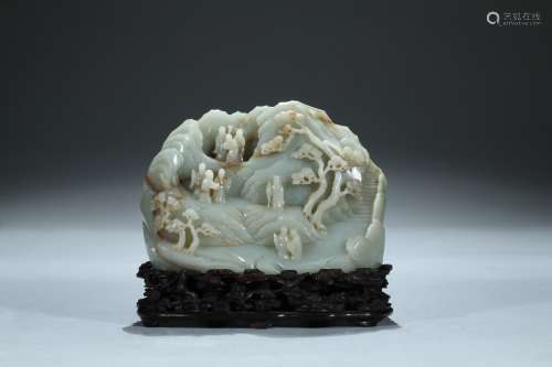 A celadon jade carved 'nine elders' boulder