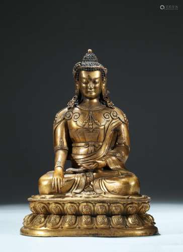 A large gilt bronze figure of shakyamuni