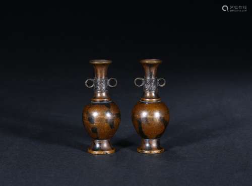 A pair of small bronze incense holders