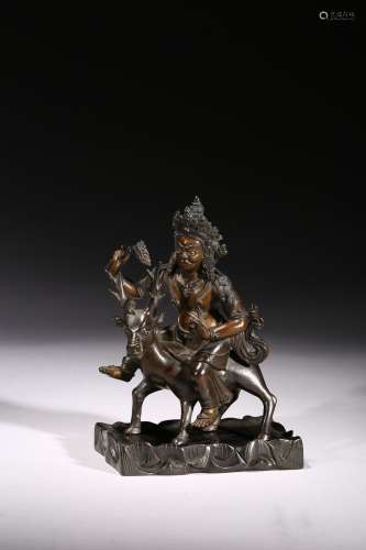 A bronze figure of Tibetan guardian
