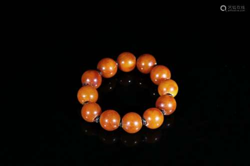 An amber twelve-bead bracelet