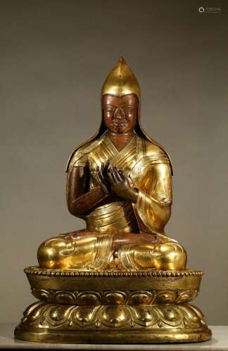 A very large gilt bronze figure of Tsongkaba