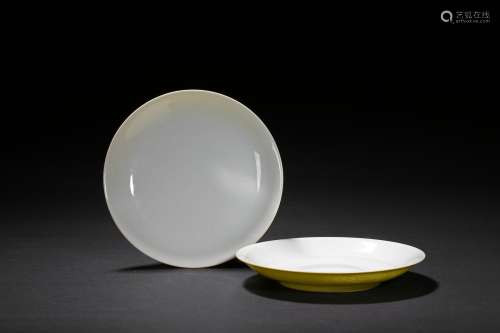 A pair of yellow glazed incised dishes