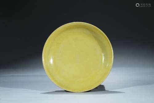 A large yellow glazed dish