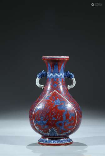 An iron red ground blue and white 'dragon phoenix' vase