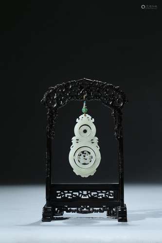 A white jade double gourd pendant with frame