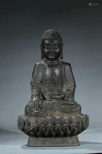 A large bronze cast figure of shakyamuni on lotus throne