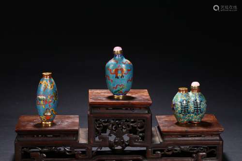 A group of three cloisonne enamel snuff bottles