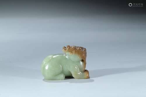 A celadon and russet jade carving of mythical beast