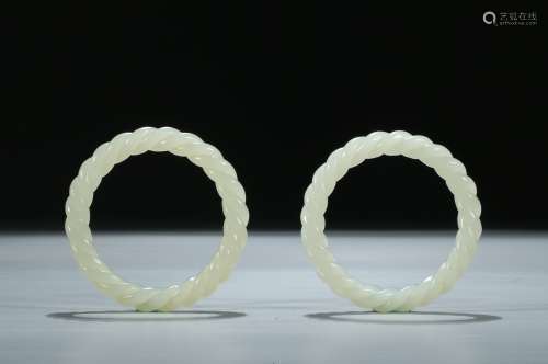 A pair of rope-twisted white jade bangles