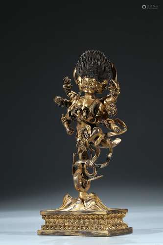 A gilt bronze figure of standing buddhist deity