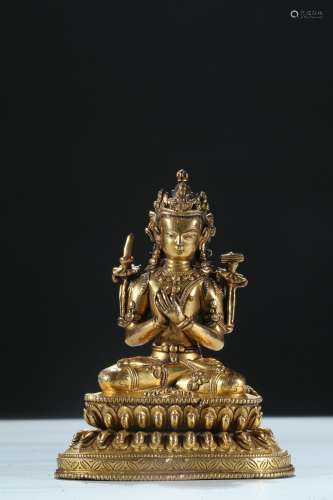 A gilt bronze figure of manjusri