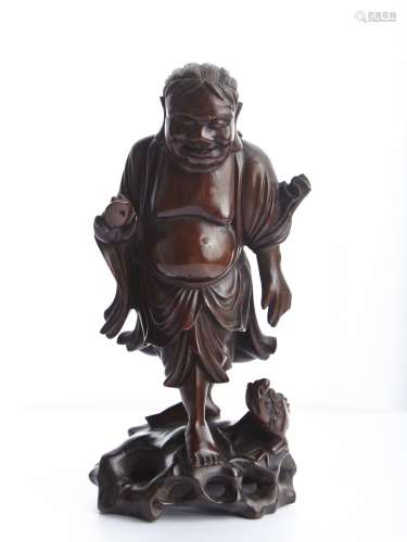 A Rosewood carved figure of Liu Hai