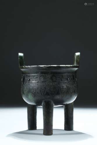 A bronze 'taotie' tripod vessel, Ding