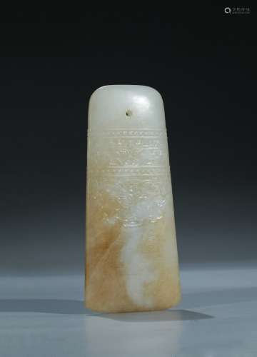 A white jade 'taotie' and inscribed ceremonial blade, gui