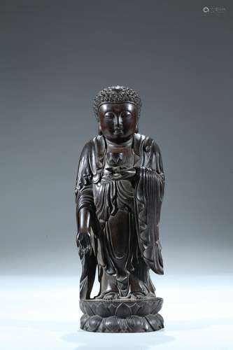 A zitan carved figure of standing shakyamuni