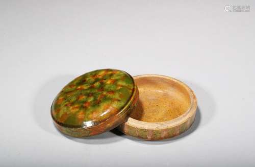 A rare sancai glazed box and cover