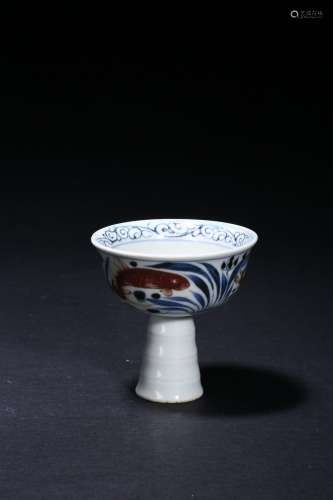 A blue and white underglazed red stem cup