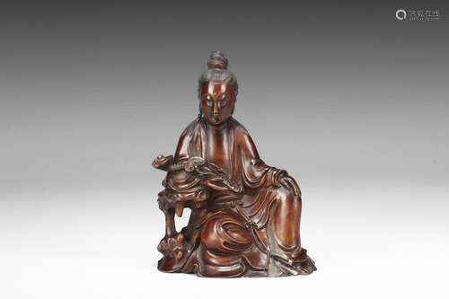 A Huanghuali Carved Figure Of Guanyin