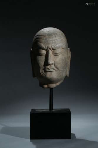 A limestone carved head of luohan