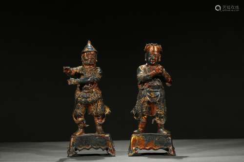 A pair of gilt-painted bronze figures